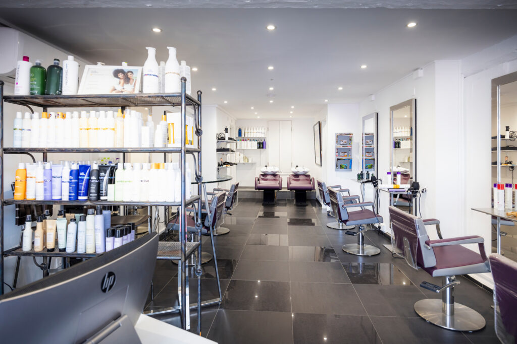 (c) Christopher Ison Photography – ISON_230705_Expressions_7848 An interior view of Expressions Hair hairdressers in Midhurst, West Sussex. Showcasing the salon chairs and hair products.