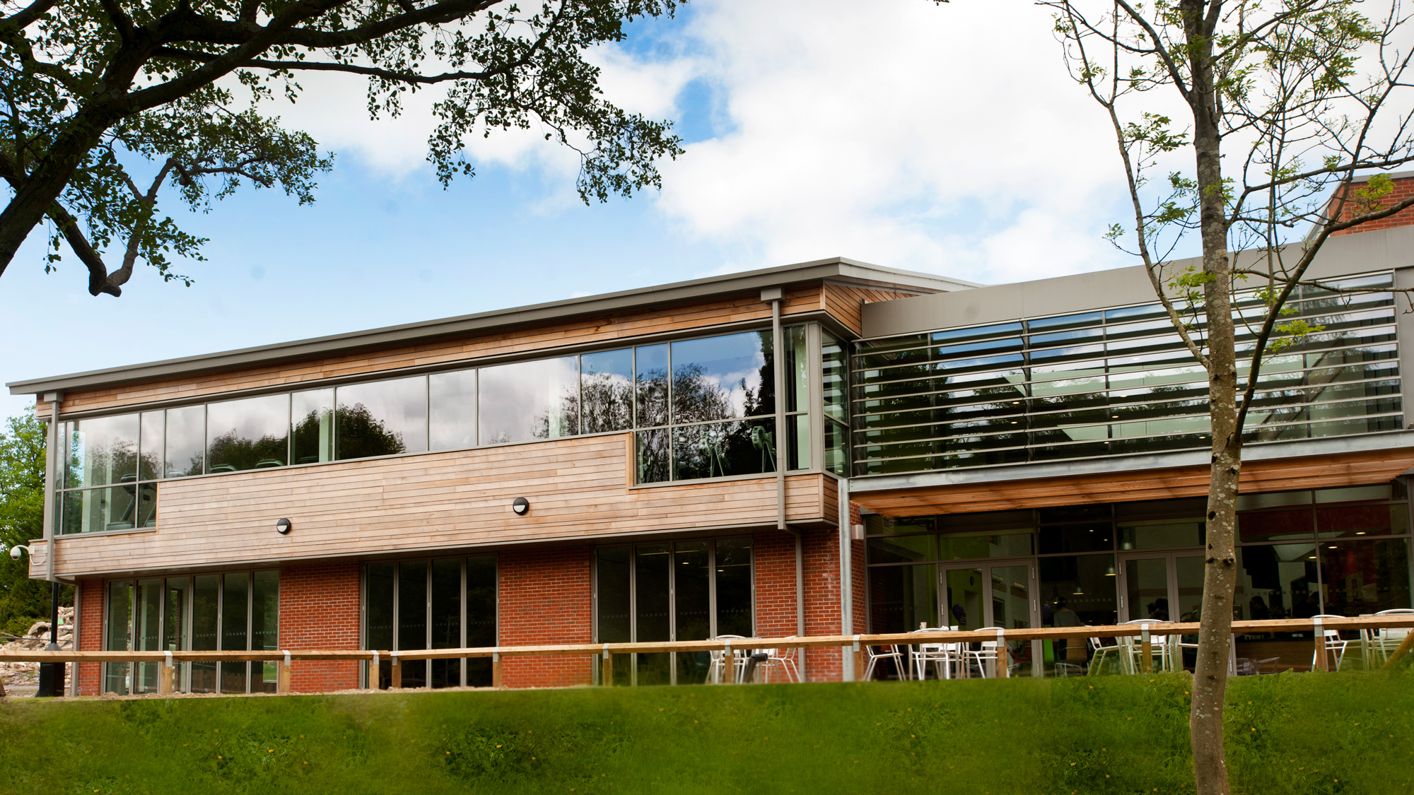 Exterior of The Grange leisure centre seen from South Pond in Midhurst, West Sussex.