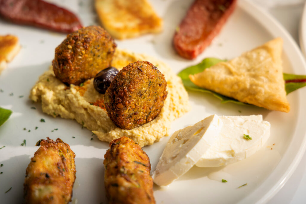 (c) Christopher Ison Photography – ISON_240819_TT_Kemaellis_0796 A closeup of hummus and falafel from Kemaellies cafe on North Street in Midhurst, West Sussex.