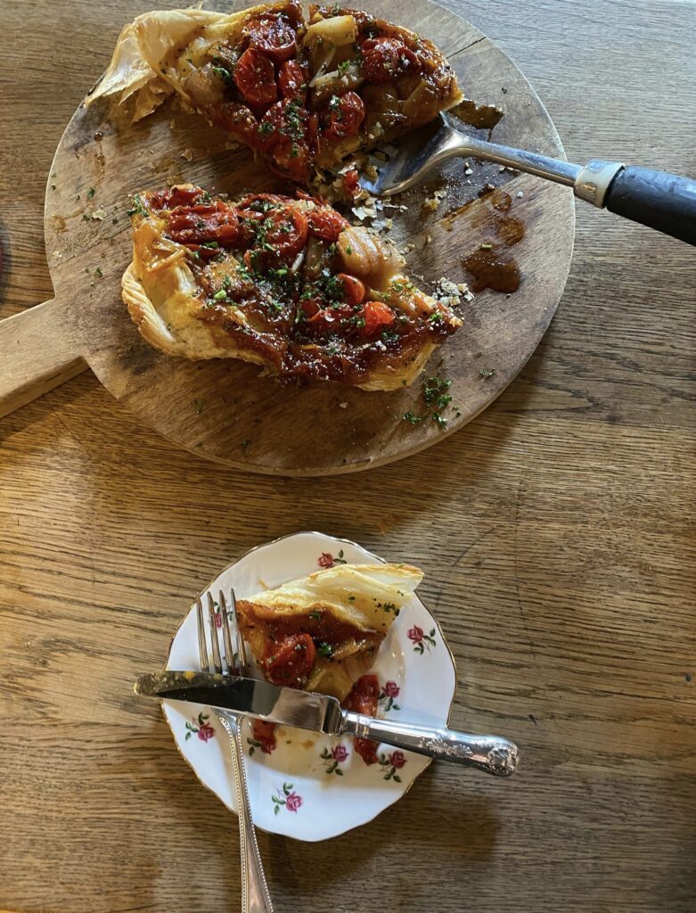 (c) The Hollist Arms – Screenshot 4 A top down view of a delicious pastry on a wooden table at The Hollist Arms pub, West Sussex.